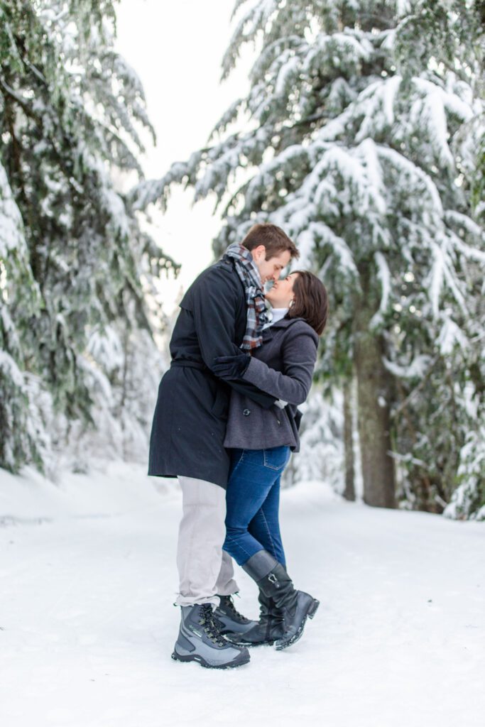 photo of a couple kissing on mount spokane in spokane, washington in the winter